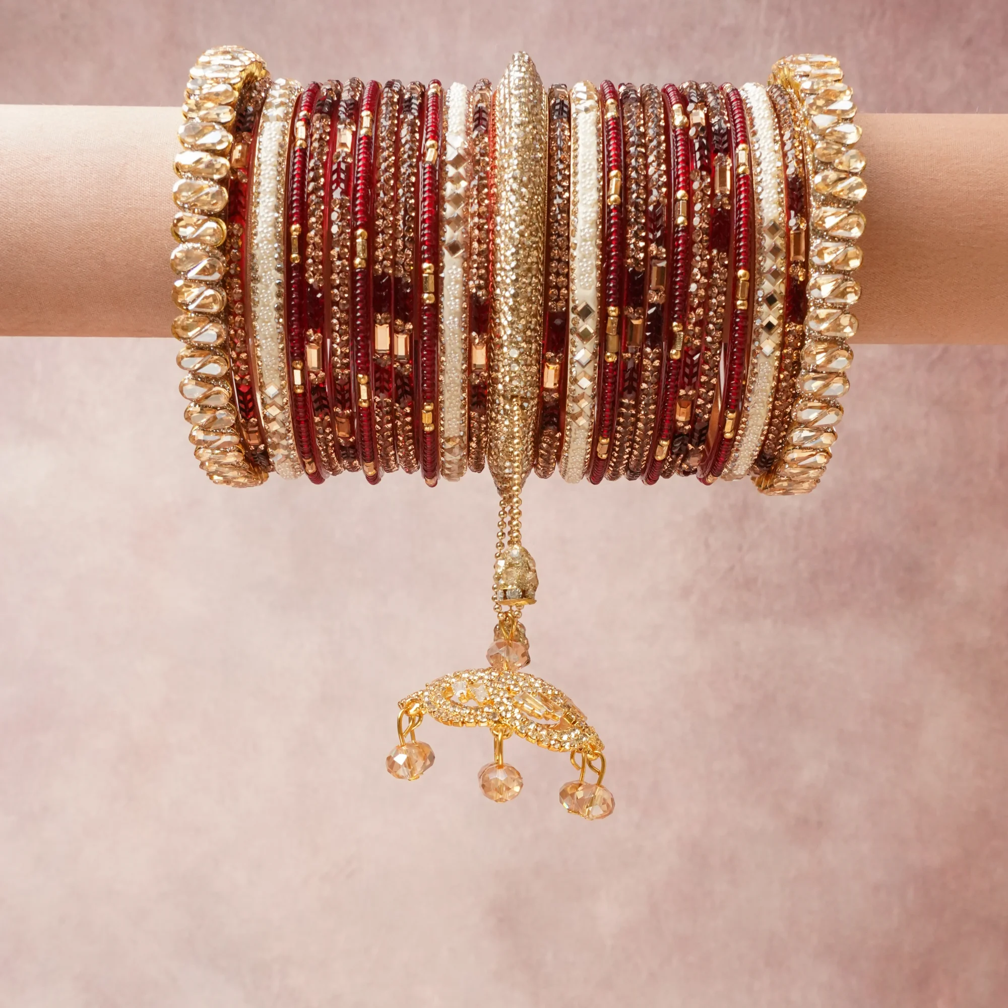 A commanding Burgundy Red anchors this beautiful set, enriched with accents of Champagne that add depth and dimension.

Featuring a striking composition of Gold-plated Alloy, Faceted Glass, Glass Beads, Resin, Lacquer, this set carries intricate craftsmanship and strong presence. Grand in form, it is created for moments that deserve to be marked.